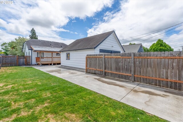 521 21st Ave, Longview, WA 98632 - view of yard featuring a wooden deck and a patio area