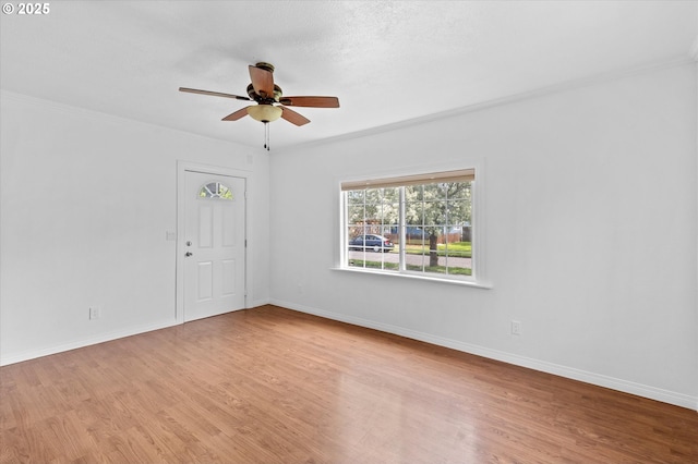 521 21st Ave, Longview, WA 98632 - spare room featuring a ceiling fan, wood finished floors, baseboards, and ornamental molding