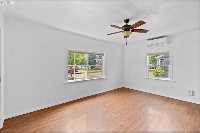 521 21st Ave, Longview, WA 98632 - unfurnished room with an AC wall unit, plenty of natural light, wood finished floors, ceiling fan, and crown molding