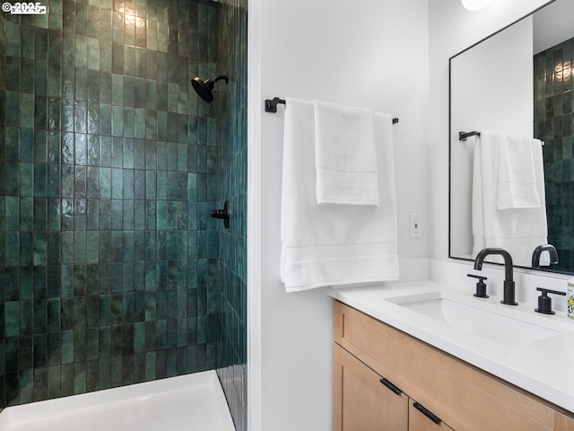bathroom featuring vanity and a tile shower