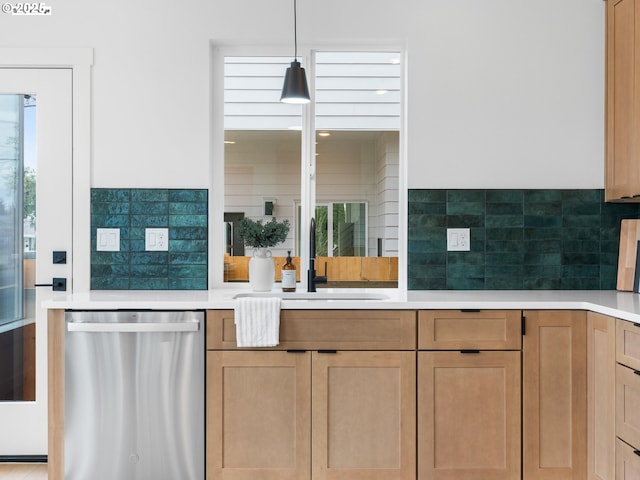 kitchen featuring a sink, light countertops, and dishwasher