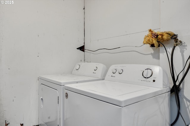 laundry room featuring laundry area and separate washer and dryer