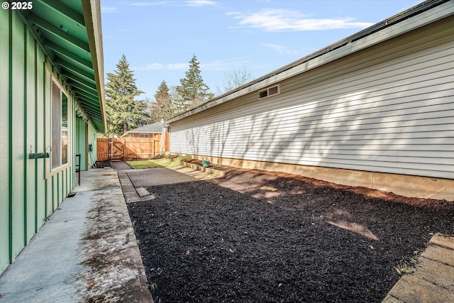 view of yard with a patio area and fence