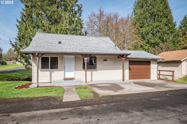 609 Woodard Ave, Castle Rock, WA 98611 - view of front facade with a front yard, a porch, a garage, concrete driveway, and roof with shingles
