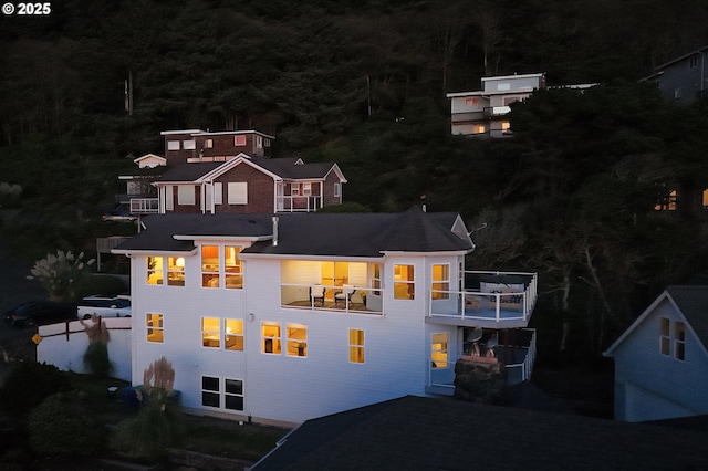 back house at night with a balcony