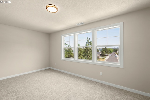 1405 Gordon Ct, The Dalles, OR 97058 - carpeted empty room featuring baseboards and a textured ceiling