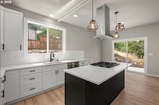 1405 Gordon Ct, The Dalles, OR 97058 - kitchen featuring exhaust hood, black gas stovetop, dishwasher, decorative backsplash, and a kitchen island