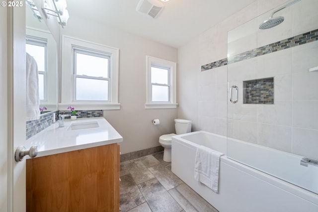 full bathroom featuring visible vents, toilet, backsplash, baseboards, and vanity