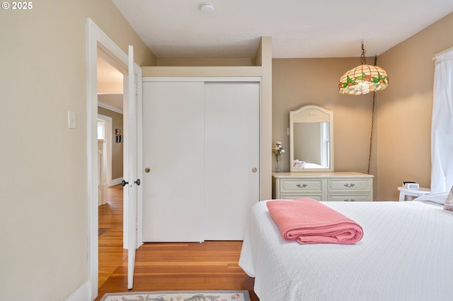 bedroom featuring a closet and wood finished floors