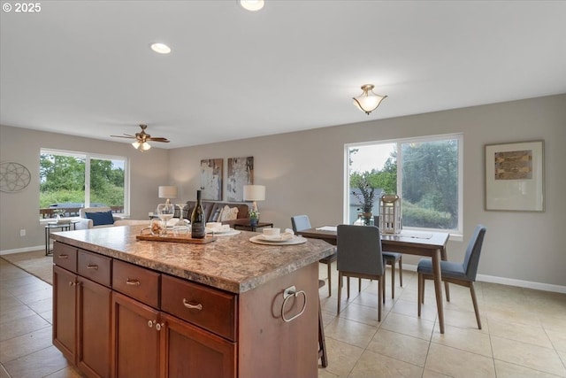 21795 SE Grand Island Loop, Dayton, OR 97114 - kitchen with a center island, light countertops, recessed lighting, a ceiling fan, and light tile patterned floors