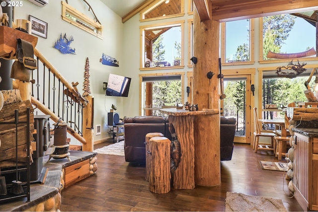 123604 Muttonchop St, Crescent Lake, OR 97733 - living area with high vaulted ceiling, dark wood-type flooring, stairs, and a wall mounted AC