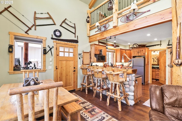 123604 Muttonchop St, Crescent Lake, OR 97733 - dining area featuring dark wood-style flooring, recessed lighting, and a towering ceiling
