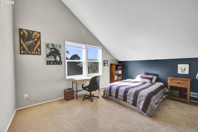 bedroom featuring vaulted ceiling and carpet flooring