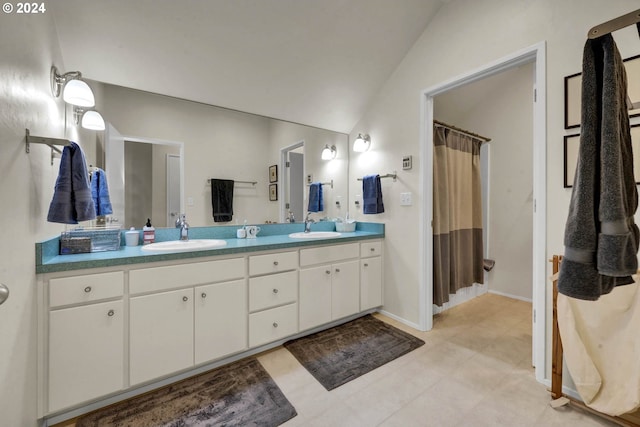 bathroom featuring vanity, lofted ceiling, and a shower with shower curtain