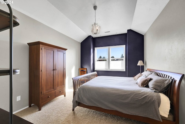 bedroom with lofted ceiling, light colored carpet, and an inviting chandelier