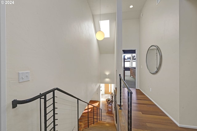 staircase with wood-type flooring