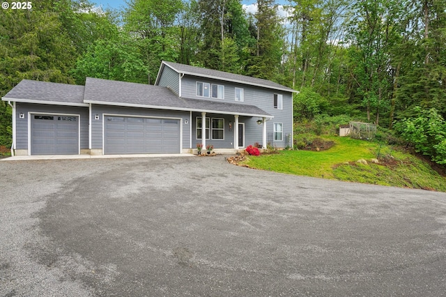 250 Sylvan Way, Longview, WA 98632 - traditional-style house with an attached garage, driveway, a front lawn, a shingled roof, and a porch