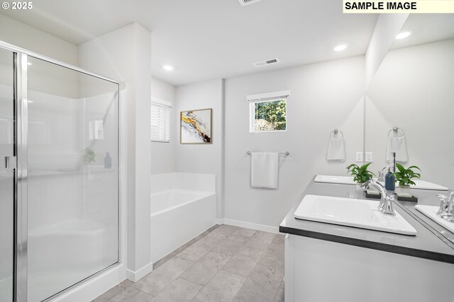 834 Misty Ln, Forest Grove, OR 97116 - full bathroom featuring double vanity, a garden tub, a shower stall, baseboards, and recessed lighting