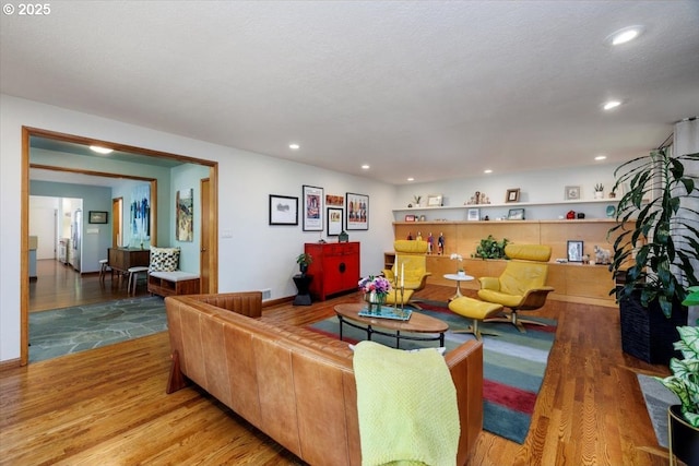 living room featuring recessed lighting and wood finished floors