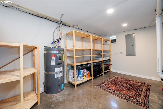 basement featuring recessed lighting, baseboards, water heater, and electric panel