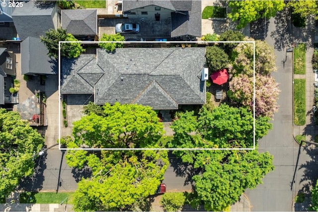 birds eye view of property with a residential view