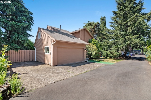 garage with fence