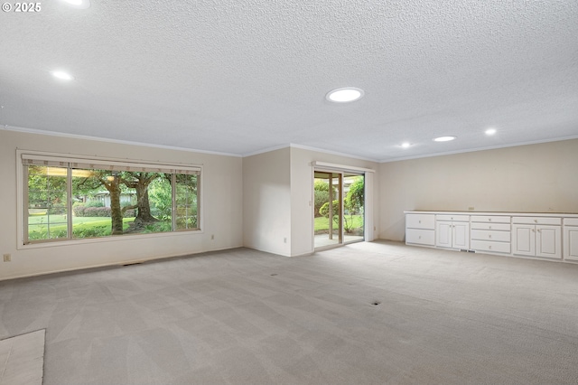 7785 SW Fairway Dr, Wilsonville, OR 97070 - unfurnished room featuring light carpet, ornamental molding, recessed lighting, a textured ceiling, and baseboards