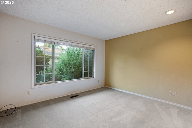 7785 SW Fairway Dr, Wilsonville, OR 97070 - carpeted spare room with baseboards, a textured ceiling, and recessed lighting