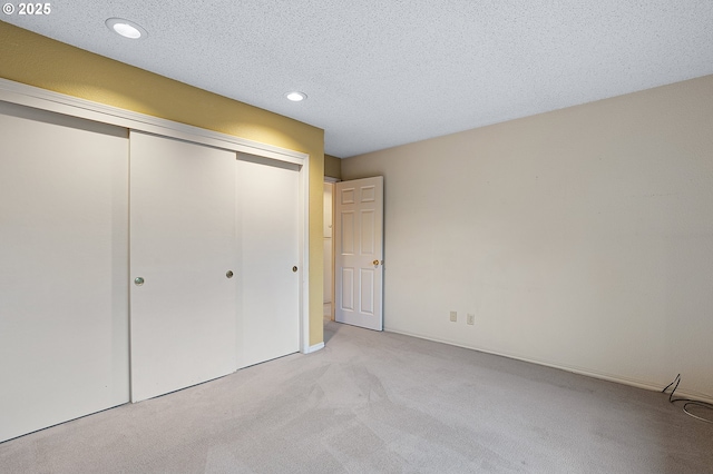 7785 SW Fairway Dr, Wilsonville, OR 97070 - unfurnished bedroom featuring light colored carpet, a closet, recessed lighting, and a textured ceiling