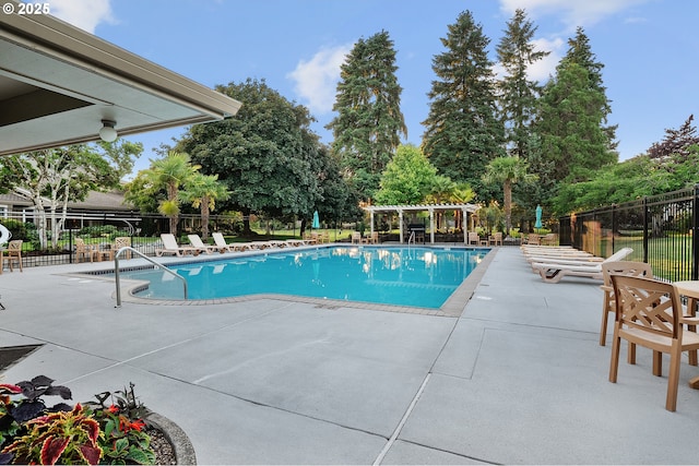 7785 SW Fairway Dr, Wilsonville, OR 97070 - community pool with a pergola, a patio, and view of wooded area
