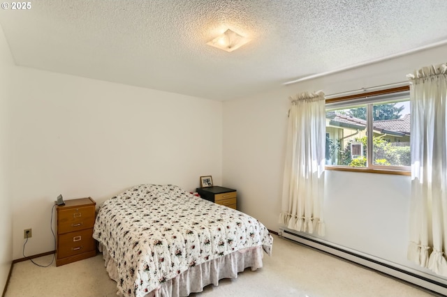 12330 SE Main St, Portland, OR 97233 - bedroom with a baseboard heating unit, a textured ceiling, and light carpet