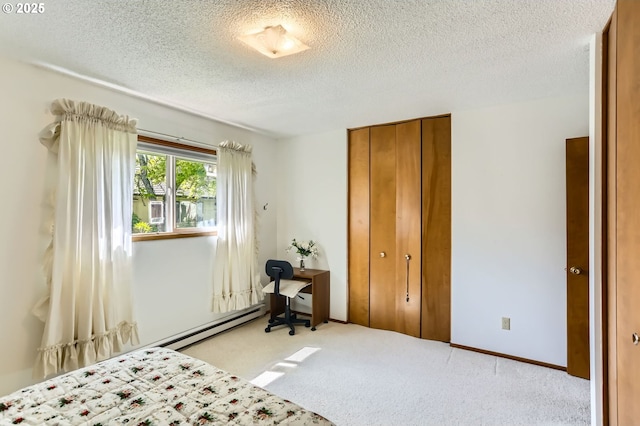 12330 SE Main St, Portland, OR 97233 - bedroom with a textured ceiling, a closet, carpet floors, and a baseboard radiator