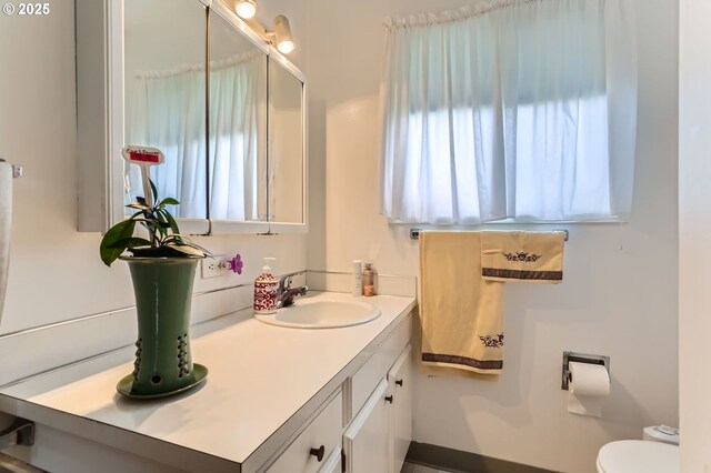 12330 SE Main St, Portland, OR 97233 - bathroom featuring plenty of natural light, vanity, and toilet