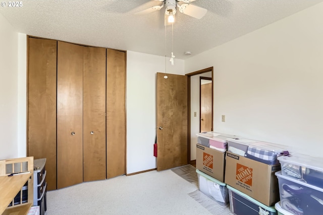 12330 SE Main St, Portland, OR 97233 - bedroom featuring a closet, a textured ceiling, light colored carpet, and a ceiling fan