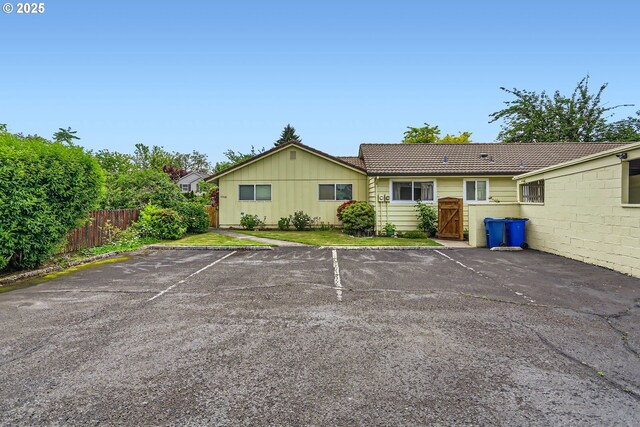 12330 SE Main St, Portland, OR 97233 - uncovered parking lot featuring a gate