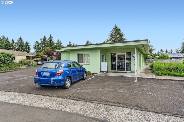 12330 SE Main St, Portland, OR 97233 - view of front facade with uncovered parking and concrete block siding