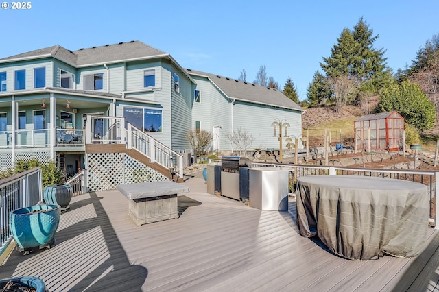 wooden deck with a storage shed