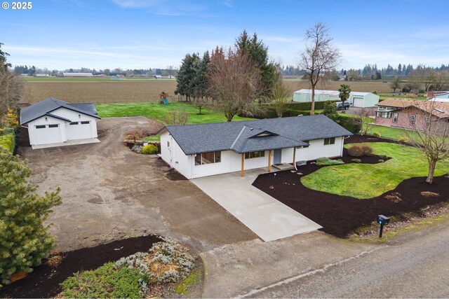 single story home featuring covered porch and a front lawn