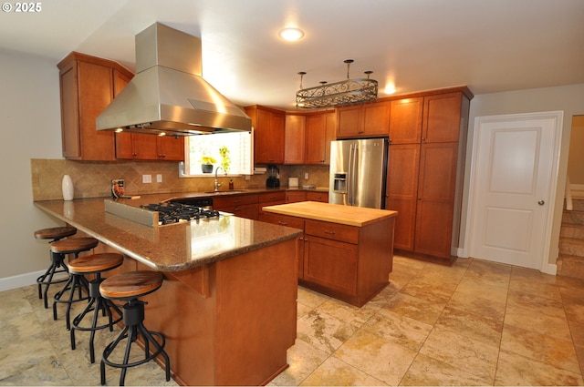13950 SW Barlow Rd, Beaverton, OR 97008 - kitchen featuring stainless steel refrigerator with ice dispenser, island range hood, a sink, stovetop, and decorative backsplash