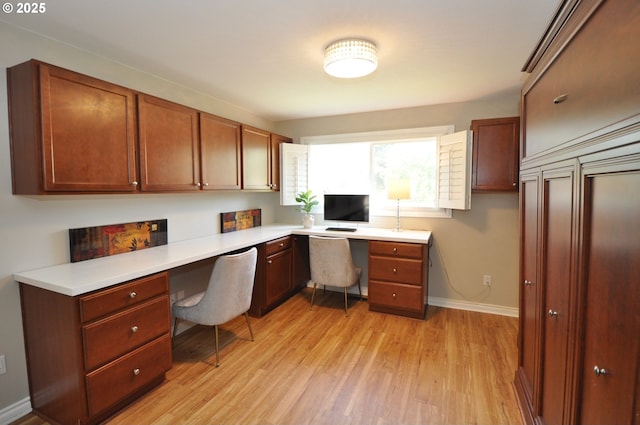 13950 SW Barlow Rd, Beaverton, OR 97008 - office area featuring built in desk, light wood-type flooring, and baseboards