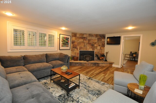13950 SW Barlow Rd, Beaverton, OR 97008 - living area with wood finished floors, a wood stove, and baseboards