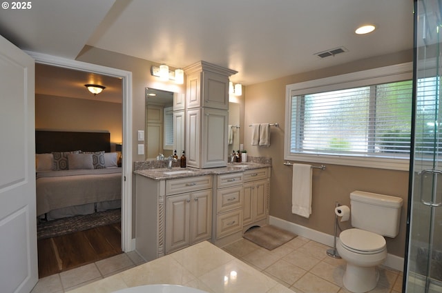 13950 SW Barlow Rd, Beaverton, OR 97008 - full bath with double vanity, baseboards, tile patterned floors, a shower with shower door, and toilet