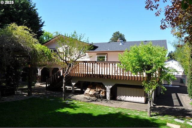 13950 SW Barlow Rd, Beaverton, OR 97008 - rear view of property featuring roof with shingles, a wooden deck, a yard, and stairway
