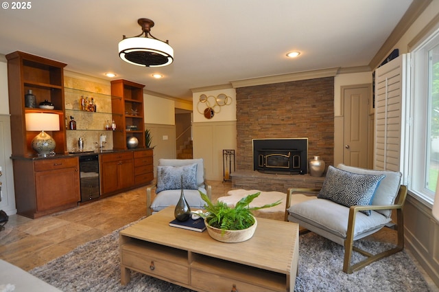 13950 SW Barlow Rd, Beaverton, OR 97008 - living room featuring wet bar, ornamental molding, a decorative wall, wine cooler, and a wainscoted wall