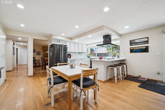11820 SW Reid Ct, Beaverton, OR 97008 - dining area featuring light wood-style flooring, recessed lighting, and baseboards