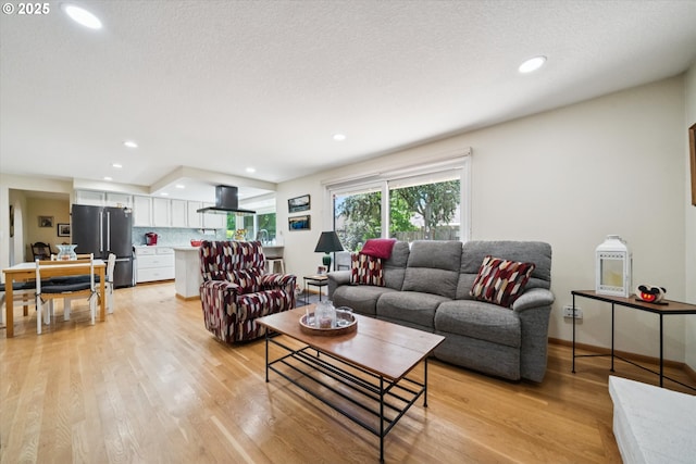 11820 SW Reid Ct, Beaverton, OR 97008 - living area with light wood-style flooring, recessed lighting, and baseboards