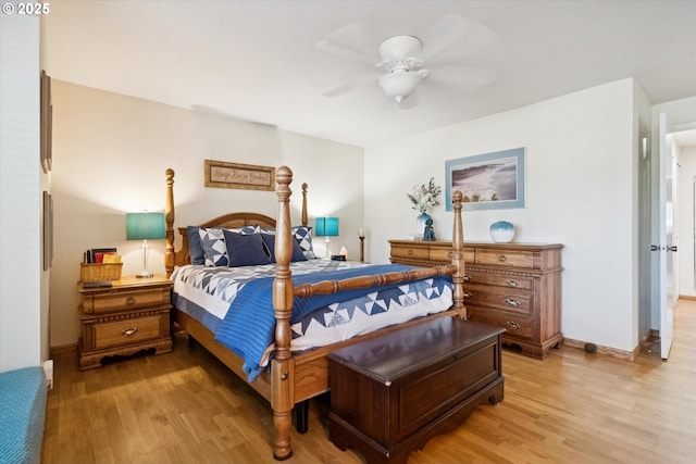 11820 SW Reid Ct, Beaverton, OR 97008 - bedroom with light wood-style floors, ceiling fan, and baseboards