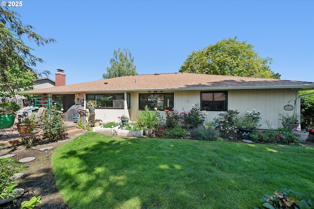 11820 SW Reid Ct, Beaverton, OR 97008 - view of front of house with a front yard and a chimney