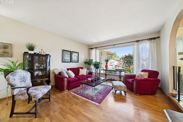 11820 SW Reid Ct, Beaverton, OR 97008 - living room featuring wood finished floors and arched walkways