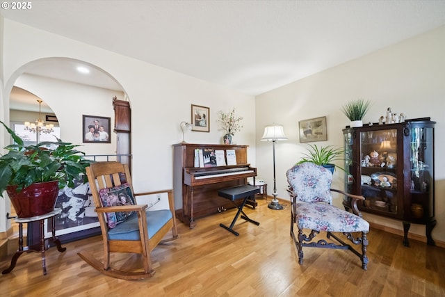 11820 SW Reid Ct, Beaverton, OR 97008 - sitting room with light wood-type flooring, arched walkways, a chandelier, and recessed lighting